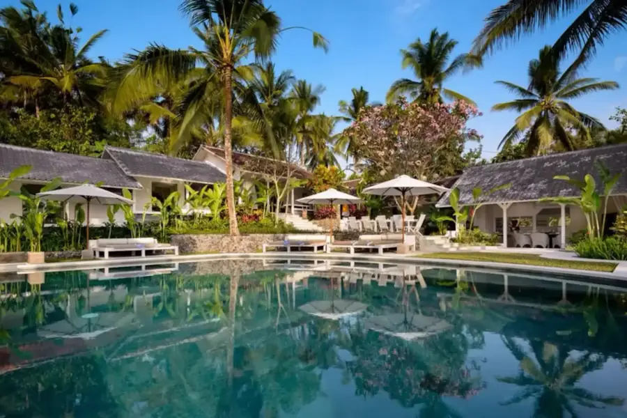 Pool and terrace area at La Balian Villa surrounded by tropical gardens in Bali